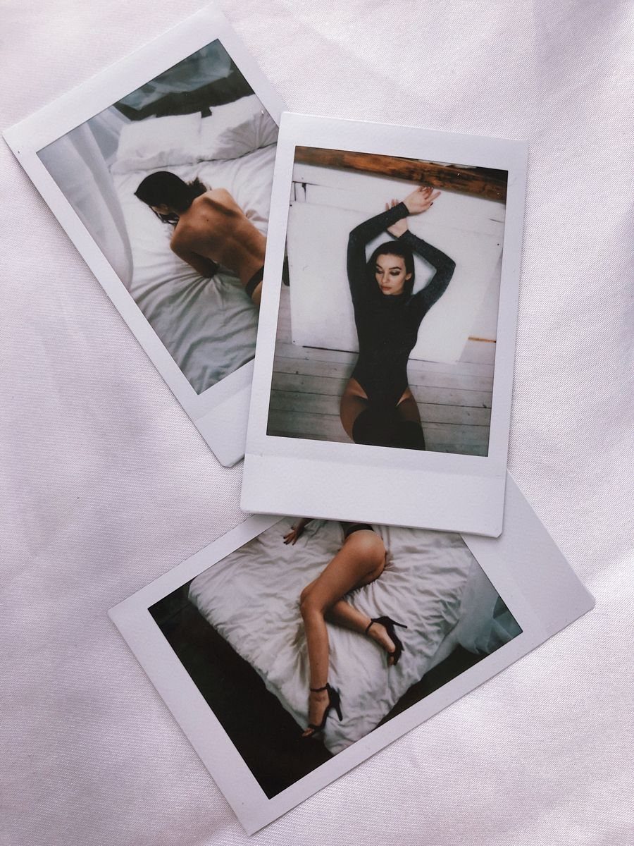 Three polaroid photos of a couple in intimate poses on a white background