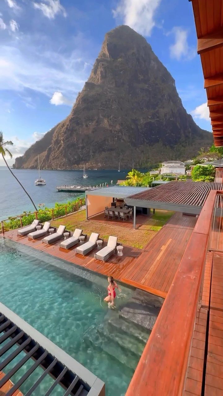 Luxury resort infinity pool and deck overlooking the Pitons mountains in St Lucia