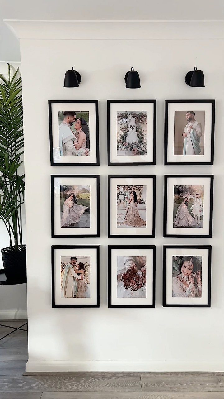 Nine black-framed wedding photos arranged in a grid on a white wall.
