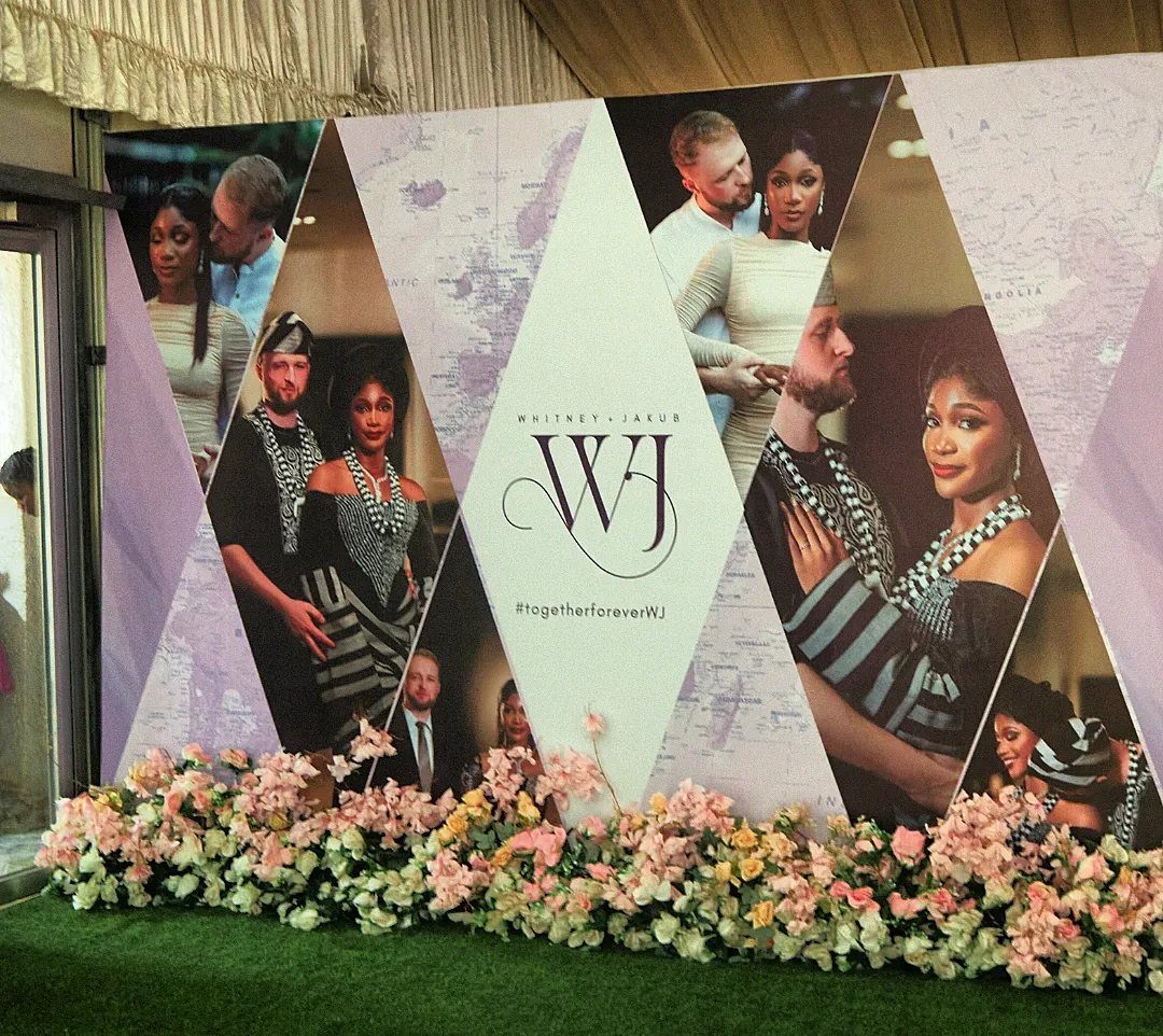 Geometric wedding photo board with couple portraits and floral arrangement at the base.